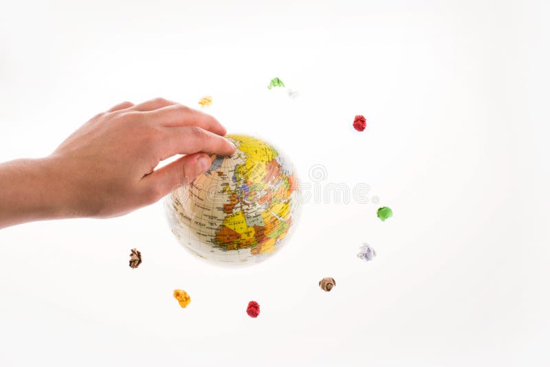 Crumpled papers form a round shape around a globe stock image