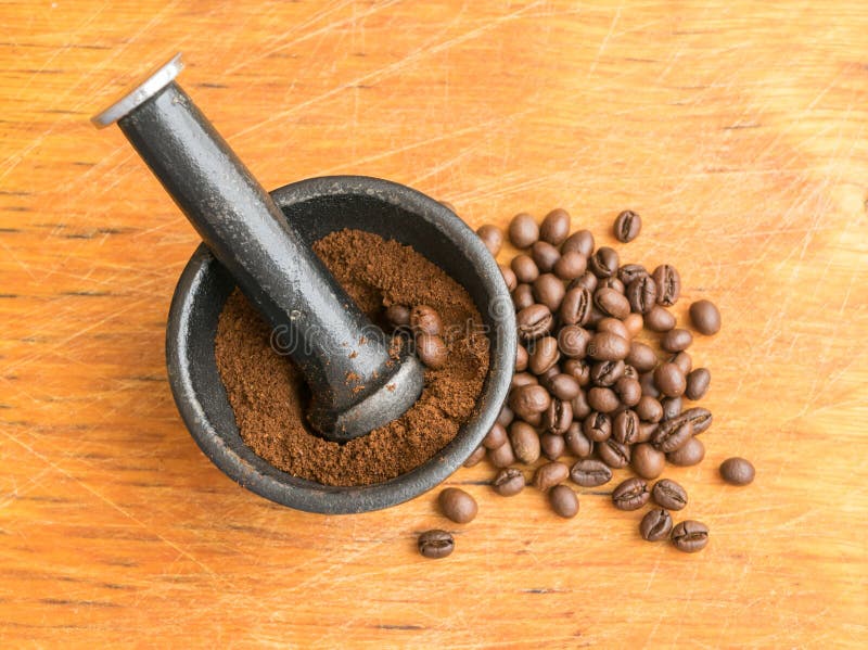 Crushed Coffee Beans in a CastIron Mortar Stock Photo Image of macro