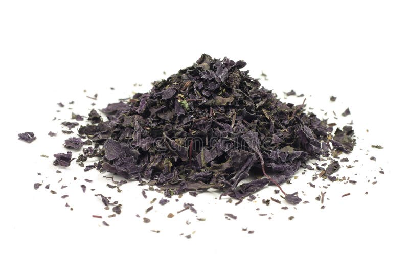 Crushed dried basil leaves stock images