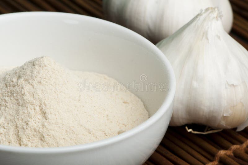 Crushed Garlic Powder and Whole Garlic Stock Image Image of food
