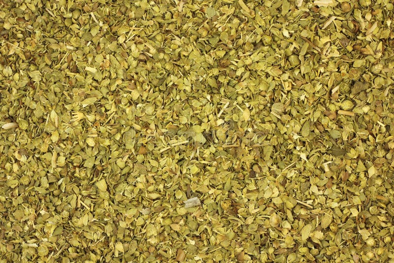 Crushed oregano leaves background stock photo