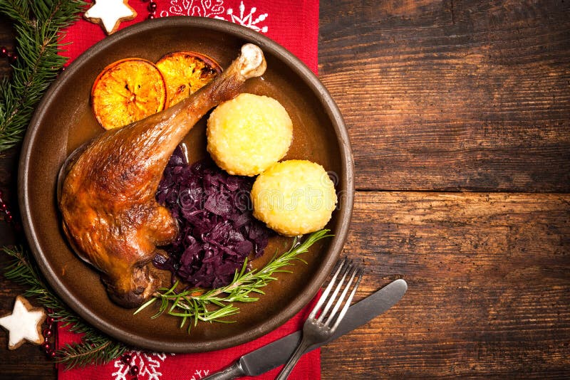 Crusty goose leg with braised red cabbage and dumplings