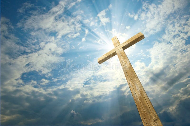 Wooden cross against the sky with shining rays. Wooden cross against the sky with shining rays