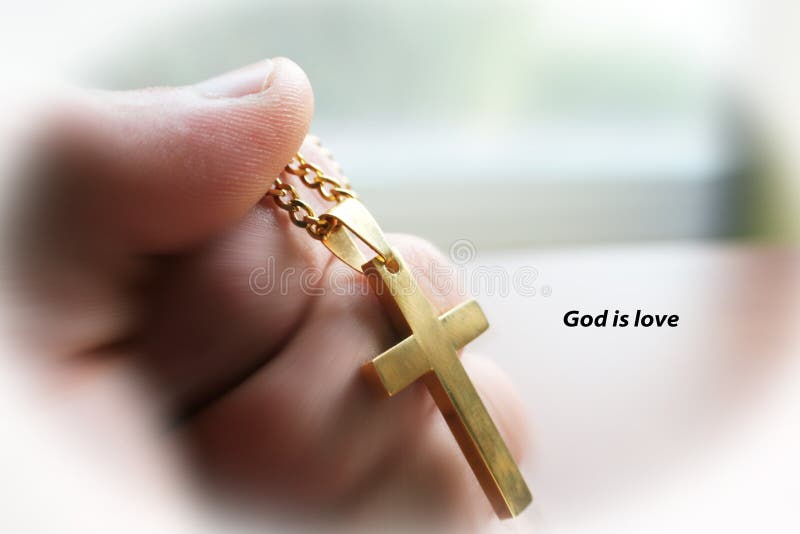 A cruz do ouro à disposição com deus é amor com o quadro branco de alta qualidade foto de stock A cruz do ouro à disposição com deus é amor com o quadro branco de alta qualidade foto de stock