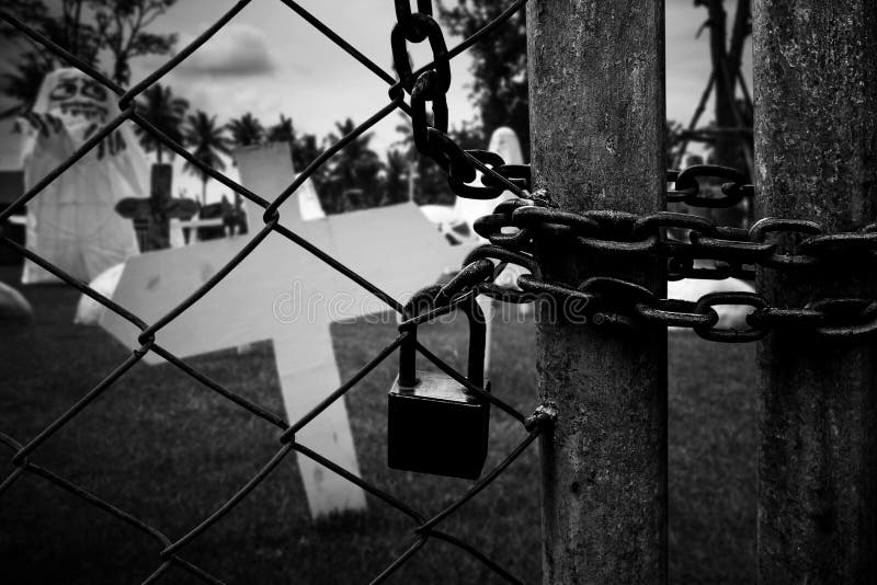 Burial cross in a graveyard - Black and white version backgrounds general. Burial cross in a graveyard - Black and white version backgrounds general