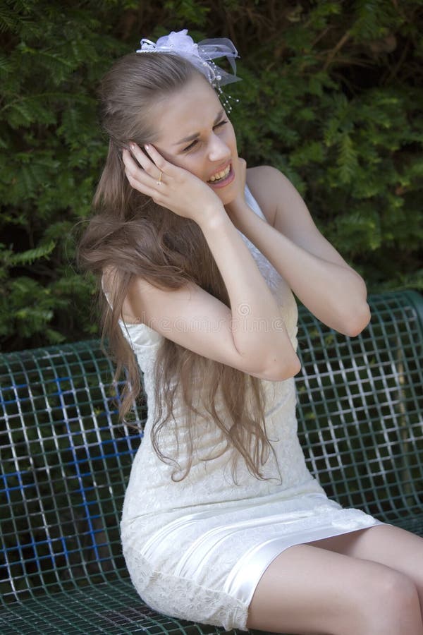 Crying bride in park