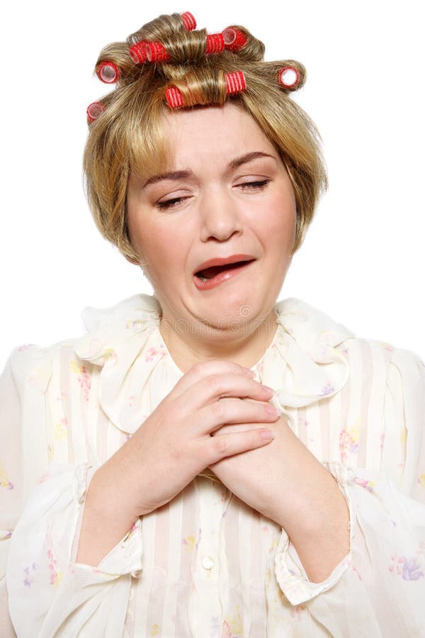 Humorous portrait of old-fashioned grotesque housekeeper with funny hairstyle and pained expression. Humorous portrait of old-fashioned grotesque housekeeper with funny hairstyle and pained expression