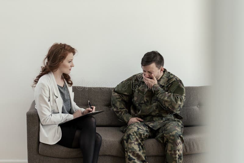 Crying soldier in green uniform during consultation with psychologist royalty free stock photos Crying soldier in green uniform during consultation with psychologist royalty free stock photos