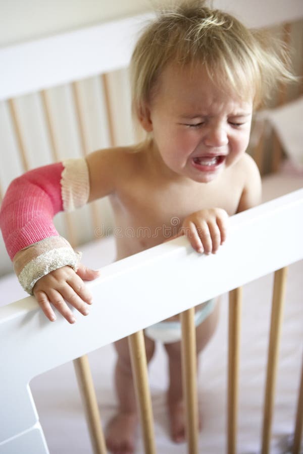Crying Toddler With Arm In Cast Stock Photo Image of plaster, little