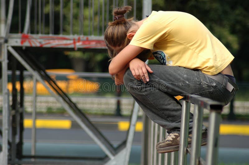 Crying young girl in park