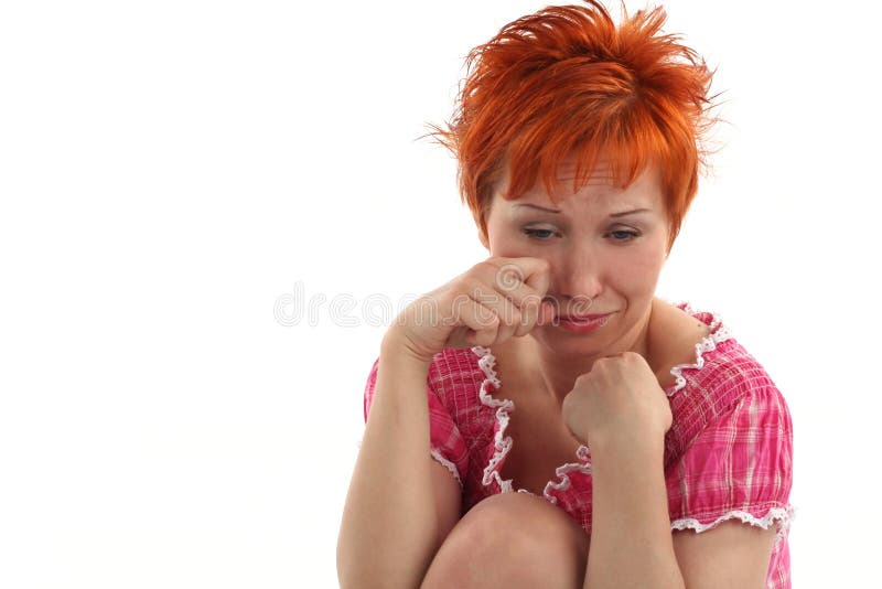 Crying young red haired woman