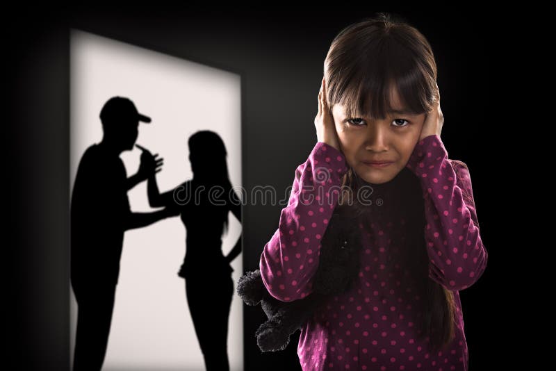 Crying illtle asian girl with her fighting parents in the background. Crying illtle asian girl with her fighting parents in the background