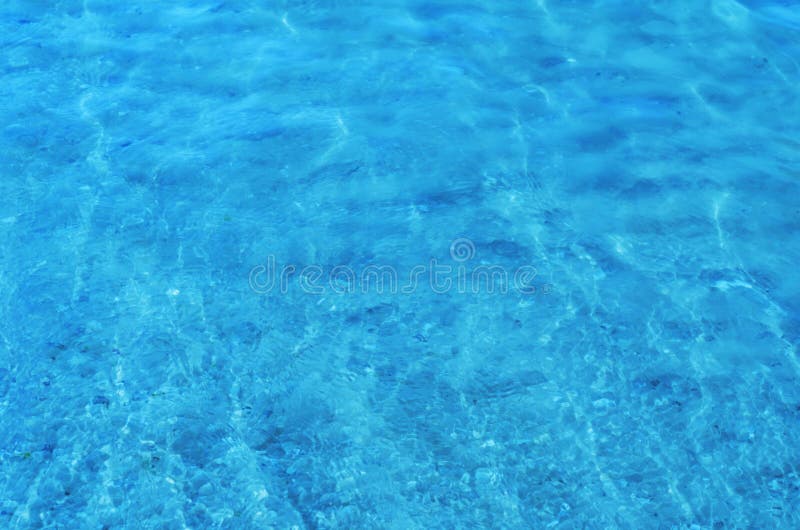 Crystal clear sea water ripples sparkling in the noon sun.