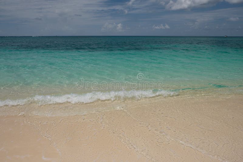 Crystal clear waters and pinkish sands on Seven Mile beach on Cayman Island royalty free stock images Crystal clear waters and pinkish sands on Seven Mile beach on Cayman Island royalty free stock images