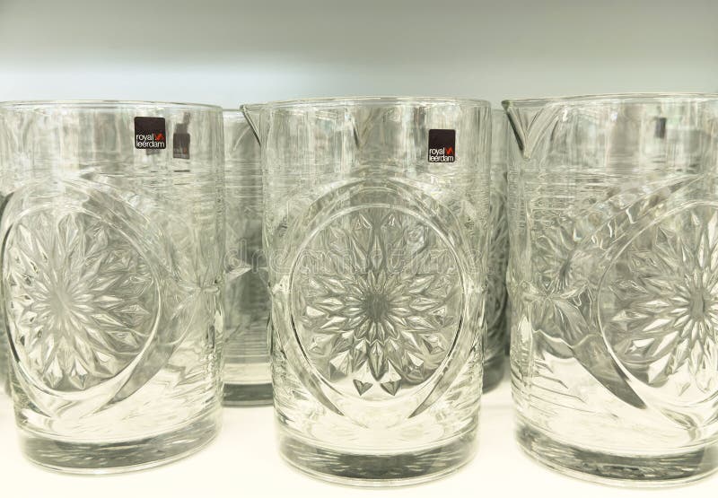 Crystal glasses with intricate patterns in a display royalty free illustration
