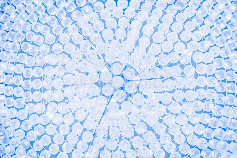 Crystal lamp, details. Fragment. Crystal pattern. Part from chandelier, glamour light background. Blue toned royalty free stock photos Crystal lamp, details. Fragment. Crystal pattern. Part from chandelier, glamour light background. Blue toned royalty free stock photos