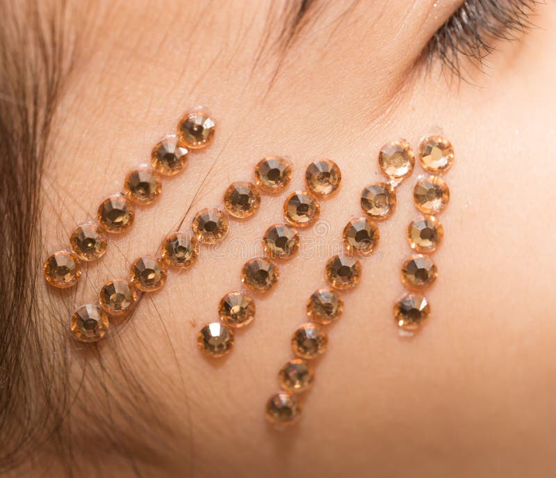Crystals on the face stock image. Image of model, eyes 107649221