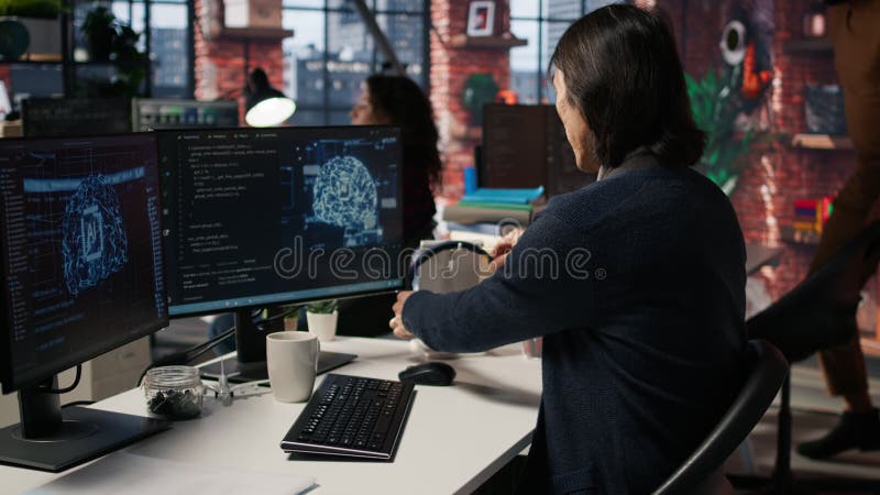 CTO manager in AI focused startup drinking coffee, listening music stock video