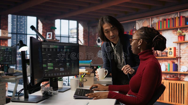CTO supervisor in AI startup bringing coffee to tired worker royalty free stock photo