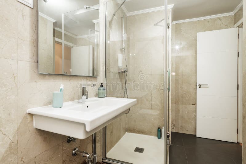 Bathroom with porcelain sink without cabinet underneath. Bathroom with porcelain sink without cabinet underneath