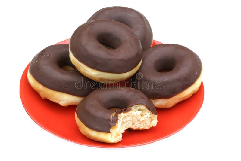 Chocolate donuts on a red dish. Chocolate donuts on a red dish.