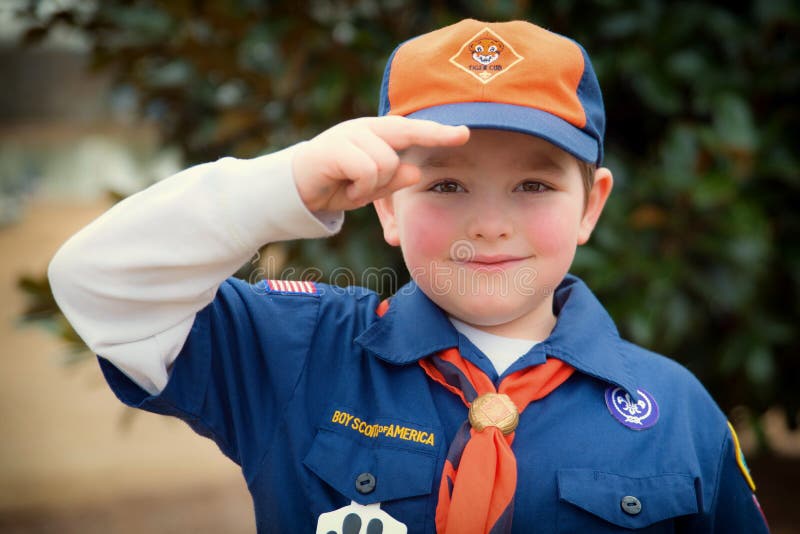 ATLANTA, GA -- FEB. 8: An unidentified Cub Scout gives the Boy Scout salute during an outdoor event on Feb. 8, 2014. More than 1. 1 million children in the U. S. participated in outdoor Scouting activities in 2013 . ATLANTA, GA -- FEB. 8: An unidentified Cub Scout gives the Boy Scout salute during an outdoor event on Feb. 8, 2014. More than 1. 1 million children in the U. S. participated in outdoor Scouting activities in 2013 .