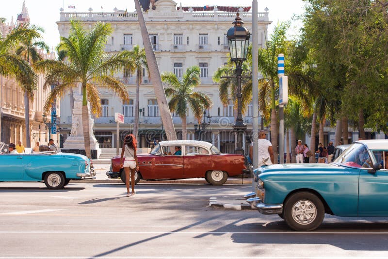 CUBA, HAVANA - MAY 5, 2017: American multicolored retro cars on city street. �opy space for text. CUBA, HAVANA - MAY 5, 2017: American multicolored retro cars stock photography CUBA, HAVANA - MAY 5, 2017: American multicolored retro cars on city street. �opy space for text. CUBA, HAVANA - MAY 5, 2017: American multicolored retro cars stock photography