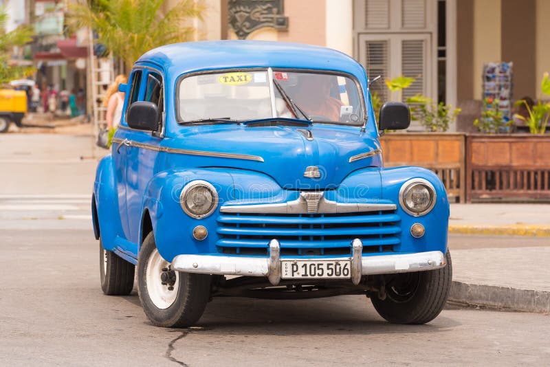 CUBA, HAVANA - MAY 5, 2017: A blue American retro car on a city street. ï¿½opy space for text.