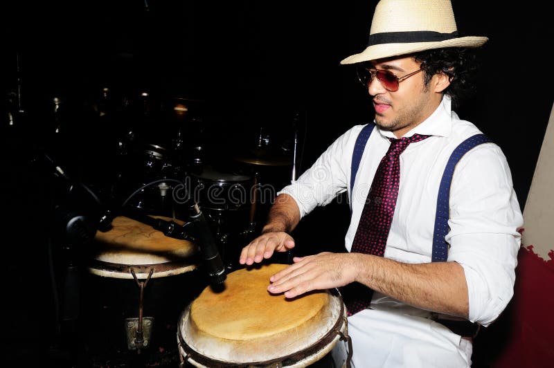 Cuban percussionist on black