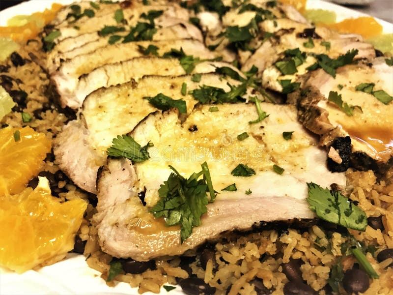 Cuban Grilled Whole Pork Loin with Rice & Beans Stock Photo - Image of