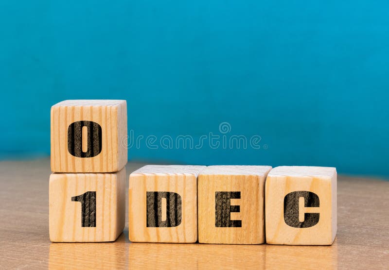 Cube shape calendar for December 01 on wooden surface with empty space for text stock photo