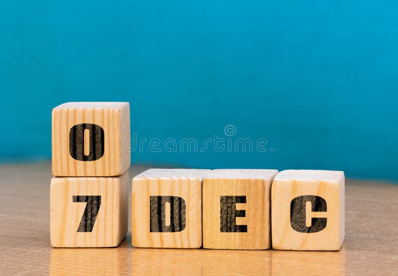 Cube shape calendar for December 07 on wooden surface with empty space for text royalty free stock photos