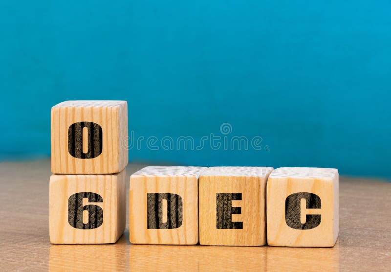 Cube shape calendar for December 06 on wooden surface with empty space for text stock images