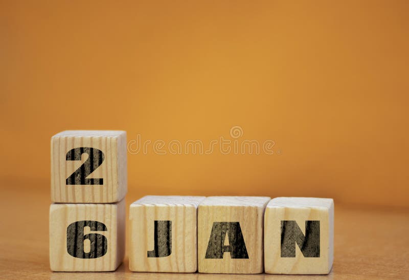 Cube shape calendar for January 26 on wooden surface with empty space for text, new year Wooden calendar with date, January cube royalty free stock photos