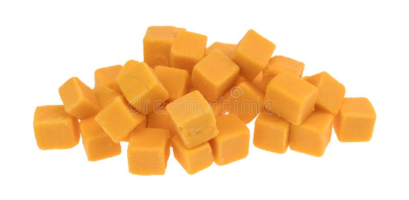 Cubed mild cheddar cheese on a white background