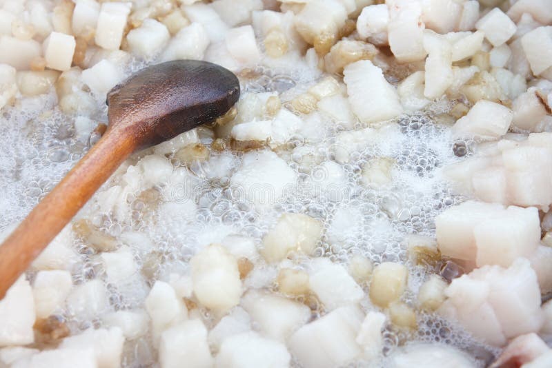 Cubed pork fat being rendered