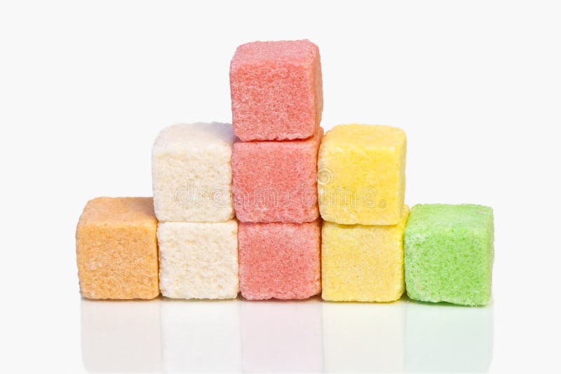 Pieces of colored sugar on a white background. Pieces of colored sugar on a white background.