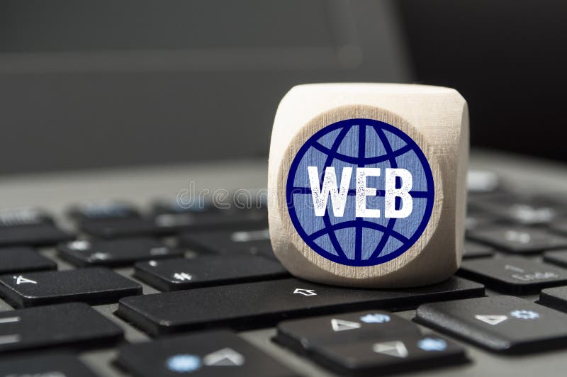 Cubes and dice with CMS and SEO on a laptop keyboard royalty free stock images Cubes and dice with CMS and SEO on a laptop keyboard royalty free stock images