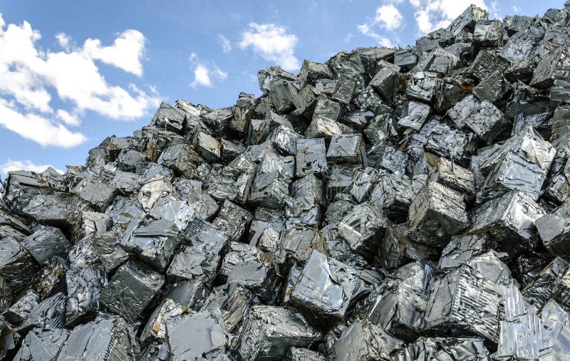 Pile of scrap metal cubes ready to be recycled. Pile of scrap metal cubes ready to be recycled.