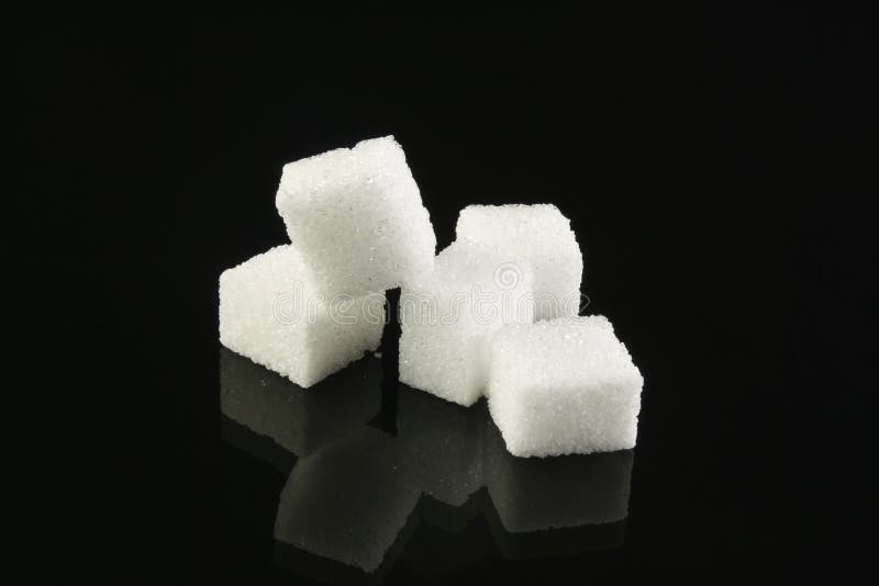 Sugar cubes on a black background. Sugar cubes on a black background