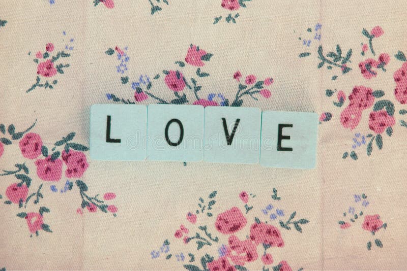 Cubes with letters love on vintage background