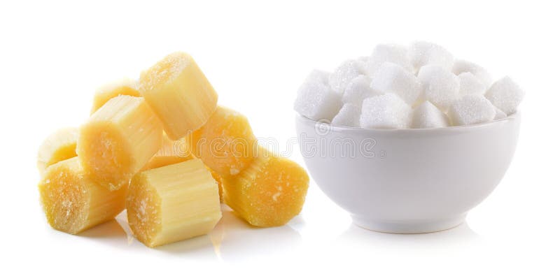 Cubo dello zucchero nella ciotola e nella canna da zucchero immagini stock Cubo dello zucchero nella ciotola e nella canna da zucchero immagini stock
