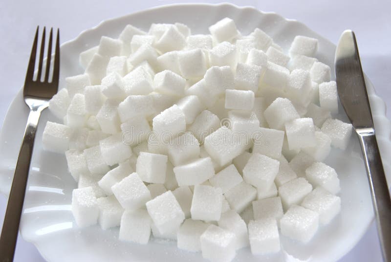 Cubos do açúcar na placa