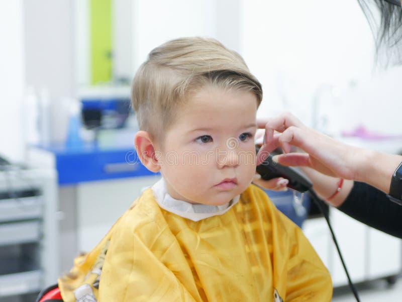 Cucasian Brunet Toddler on the Haircut with a Professional Children S Hairdresser. Stock Image - Image of beauty, brunete: 215759385 Cucasian Brunet Toddler on the Haircut with a Professional Children S Hairdresser. Stock Image - Image of beauty, brunete: 215759385