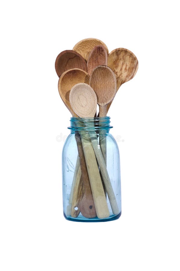 Cucchiai di legno in un vaso d'inscatolamento blu
