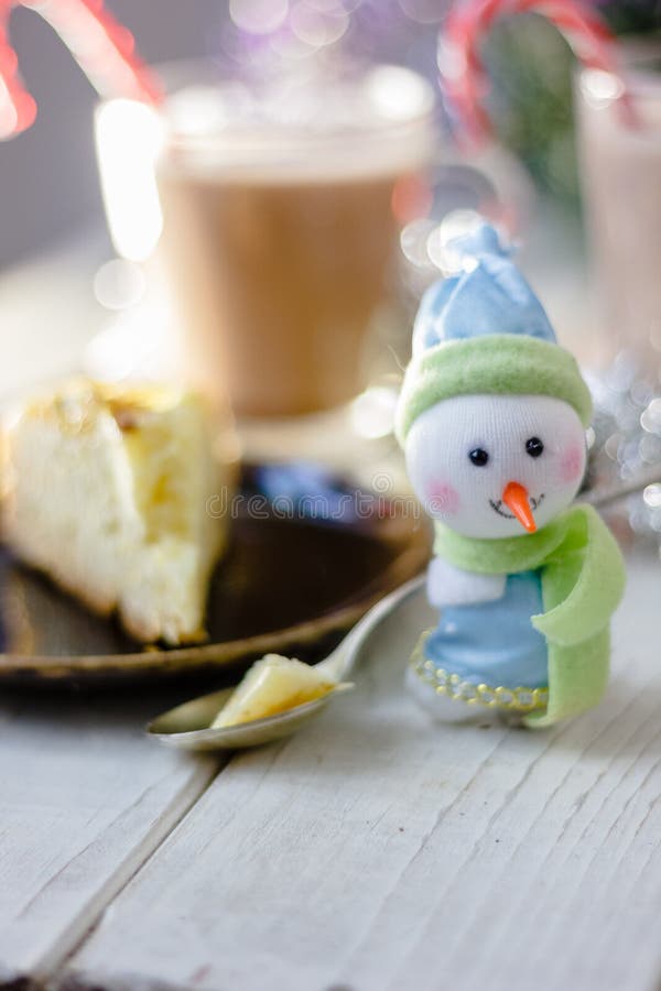 Christmas snowman holding spoon with christmas pie in hands. Christmas snowman holding spoon with christmas pie in hands