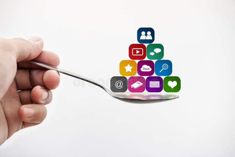 Hand holding spoon with media application icons. Social media and mobile application addicted concepts. Hand holding spoon with media application icons. Social media and mobile application addicted concepts