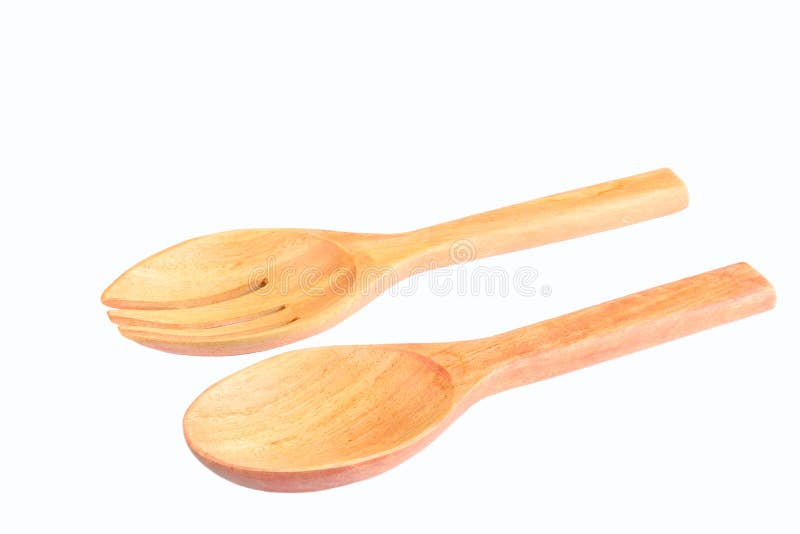 Cucchiaio e forchetta di legno su fondo bianco fotografie stock Cucchiaio e forchetta di legno su fondo bianco fotografie stock