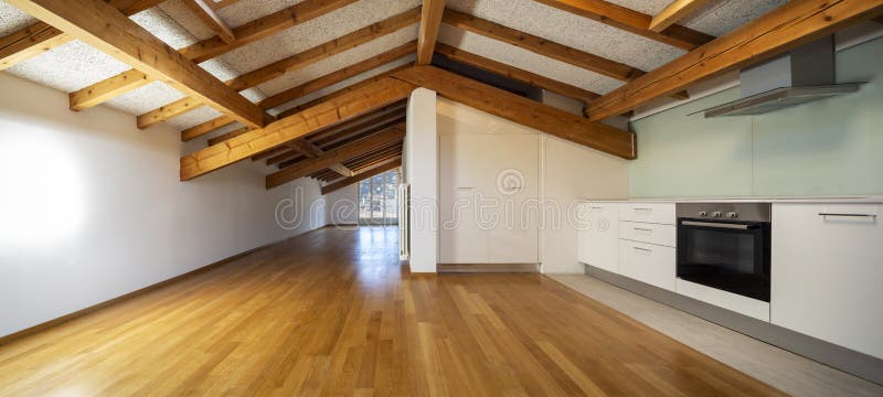Kitchen in empty apartment with wooden beams. Nobody inside. Kitchen in empty apartment with wooden beams. Nobody inside