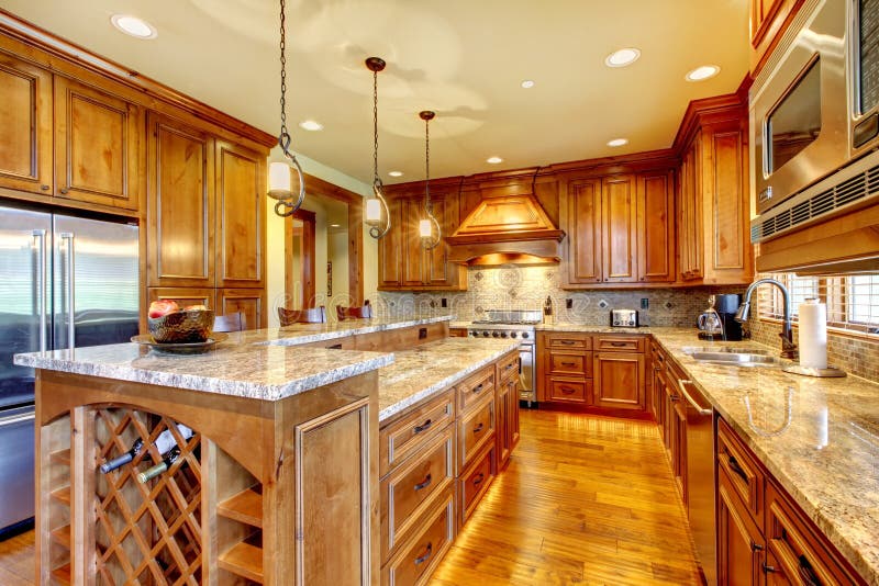 Brilliant kitchen with stained wood cabinets, and glossy counter tops. Brilliant kitchen with stained wood cabinets, and glossy counter tops.